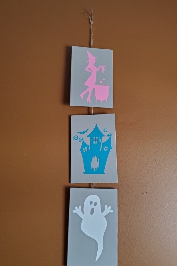 A photo of a simple halloween cricut project, using dollar tree canvases and HTV.