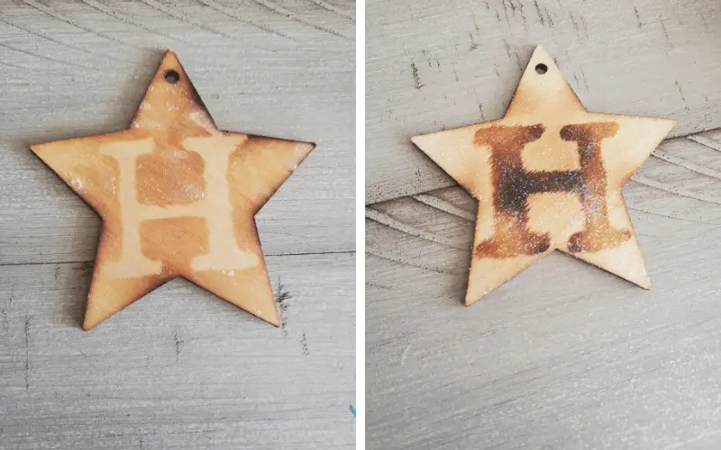 Shows two wood burned star ornaments with the letter H